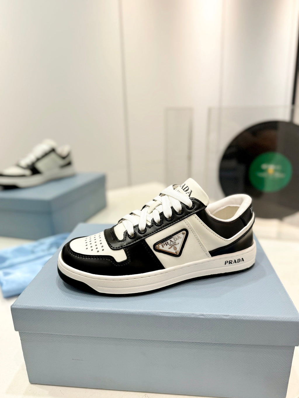 PRADA DOWNTOWN PERFORATED SNEAKERS BLACK AND WHITE CALFSKIN