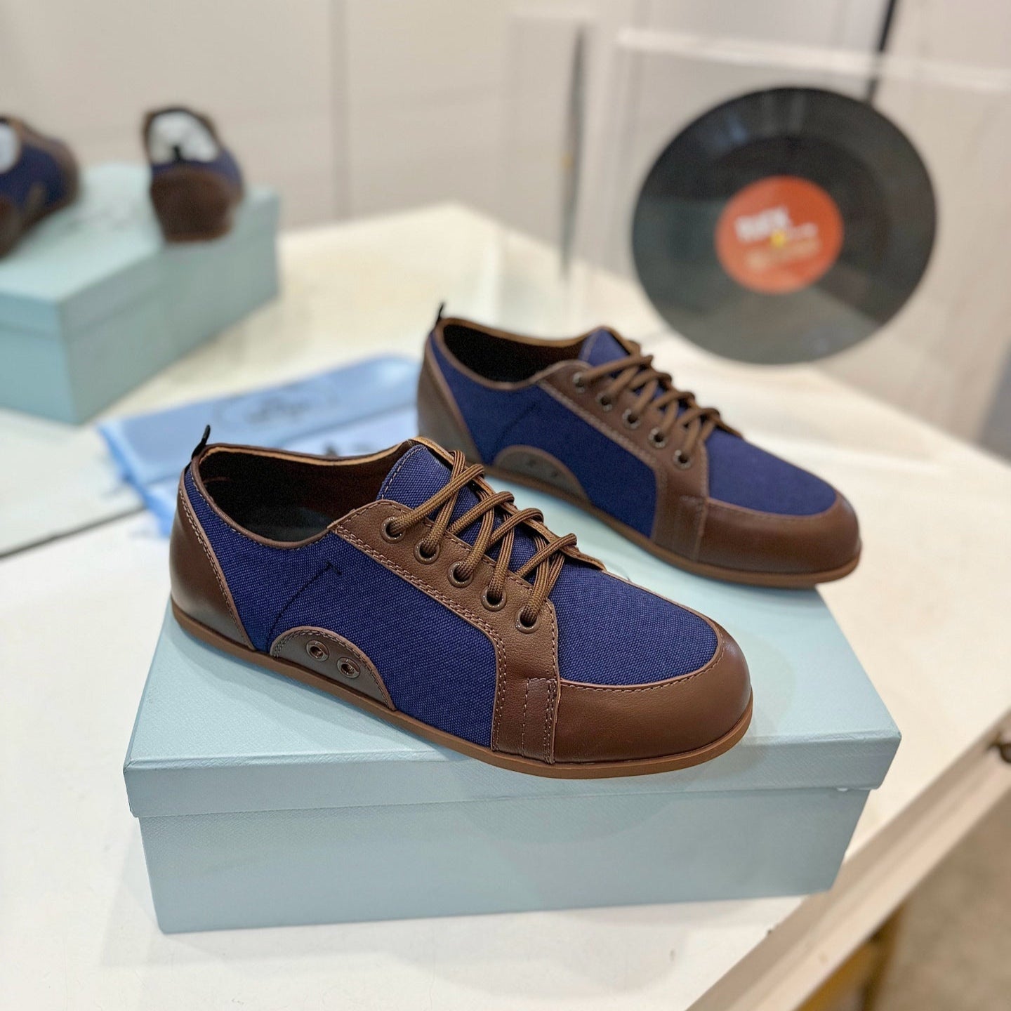 PRADA SNEAKERS IN BROWN LAMBSKIN AND NAVY BLUE CANVAS