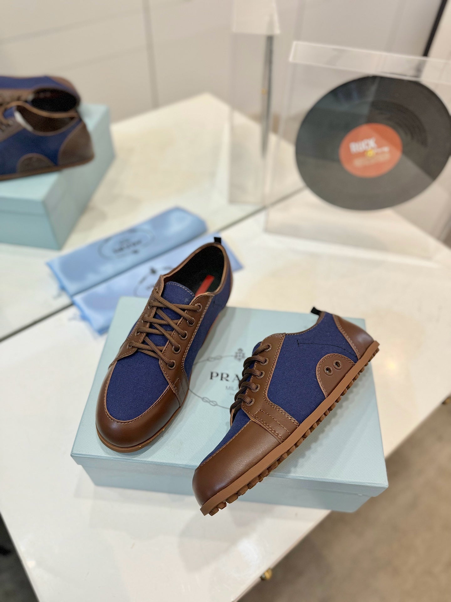 PRADA SNEAKERS IN BROWN LAMBSKIN AND NAVY BLUE CANVAS