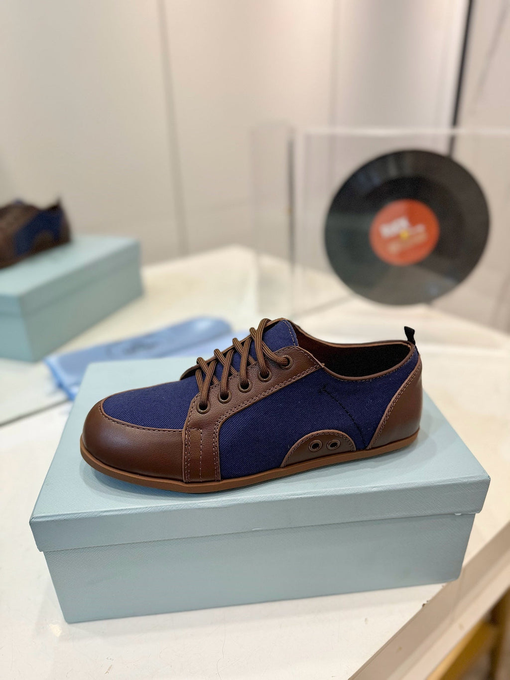 PRADA SNEAKERS IN BROWN LAMBSKIN AND NAVY BLUE CANVAS