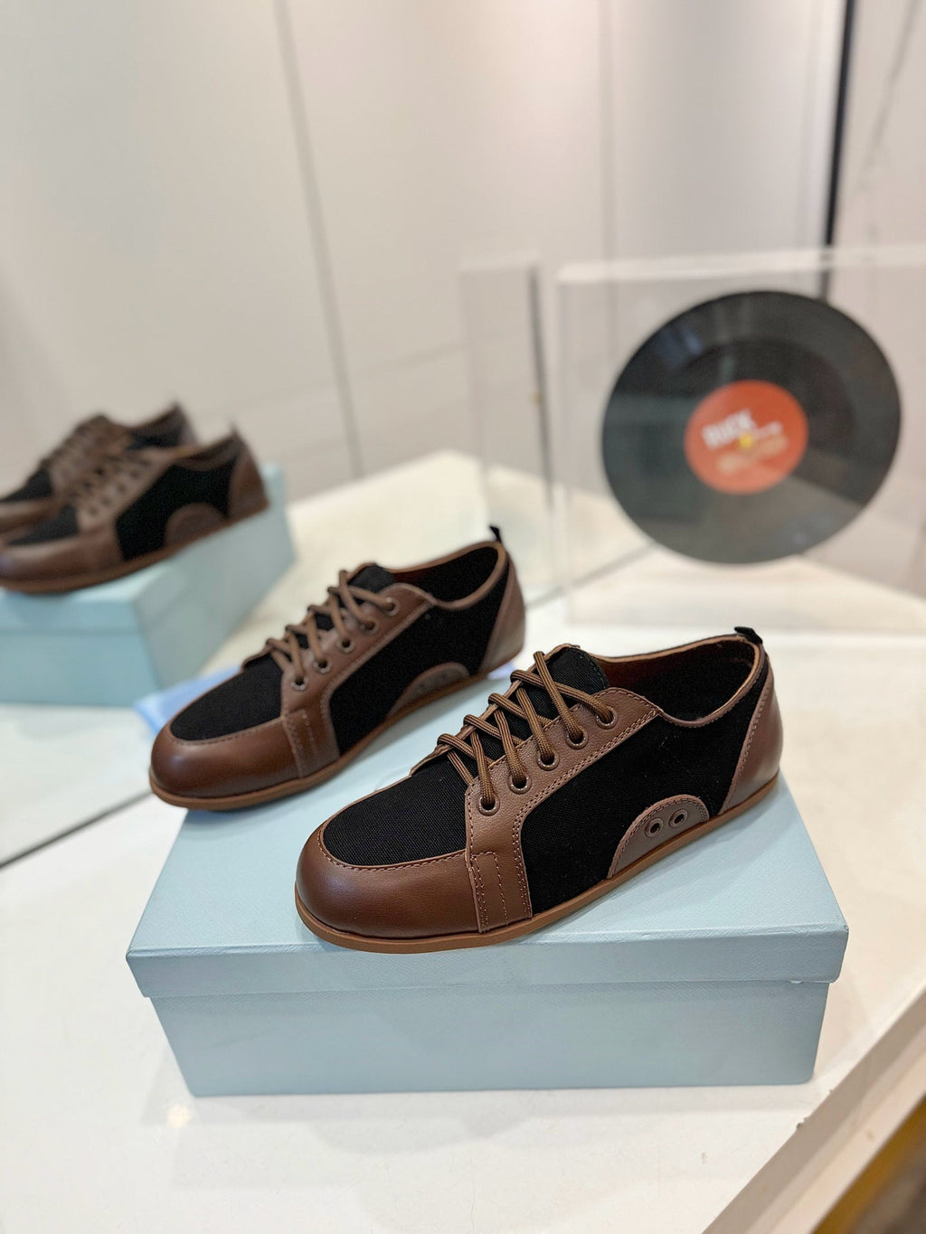 PRADA SNEAKERS IN BROWN LAMBSKIN AND BLACK CANVAS