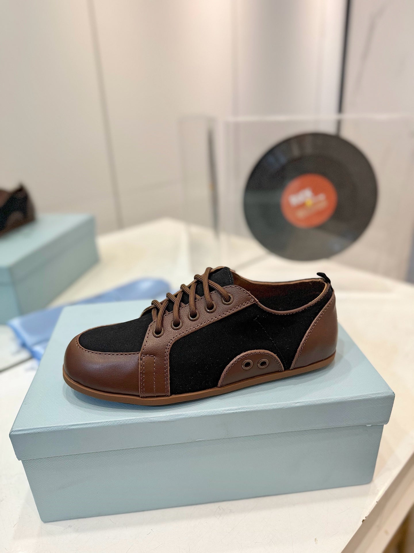 PRADA SNEAKERS IN BROWN LAMBSKIN AND BLACK CANVAS