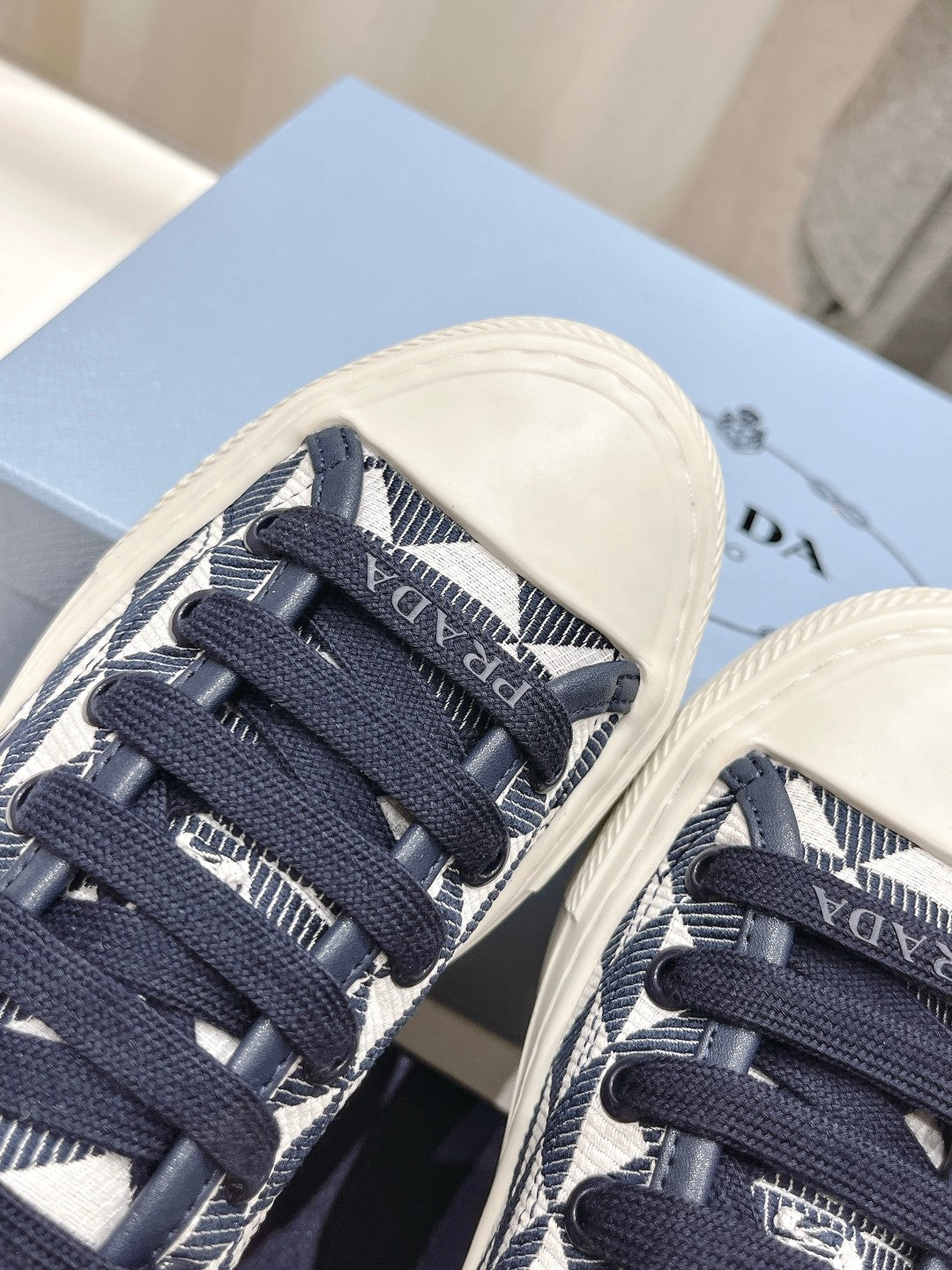 PRADA PRINTED COTTON SNEAKERS WHITE AND BLACK TRIANGLE CANVAS